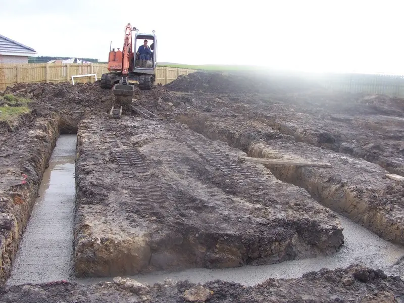 Foundation trenches dug and concrete poured