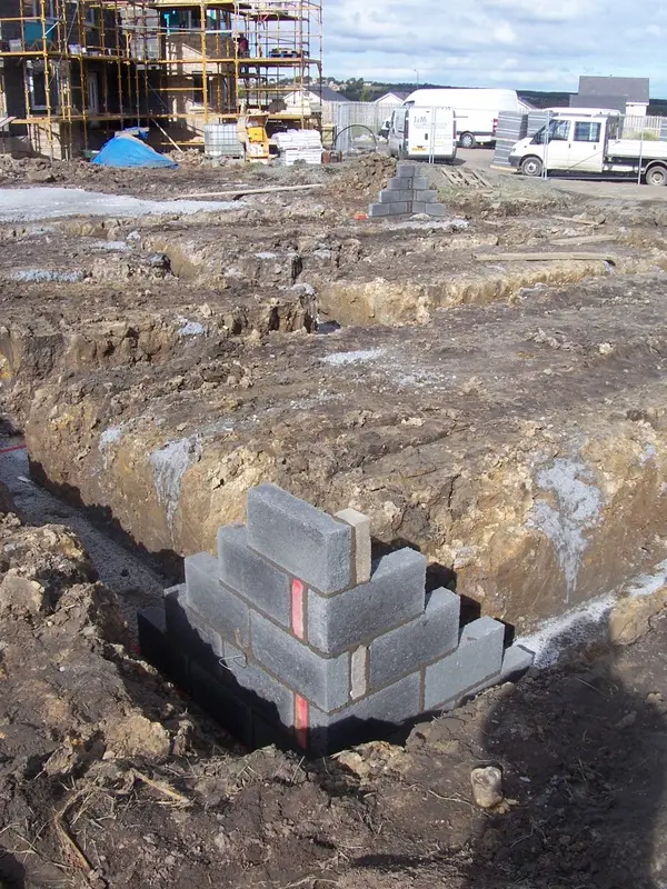 First blockwork rising from the foundation trench