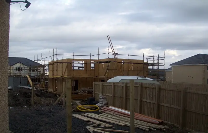 Timber frame up under scaffold