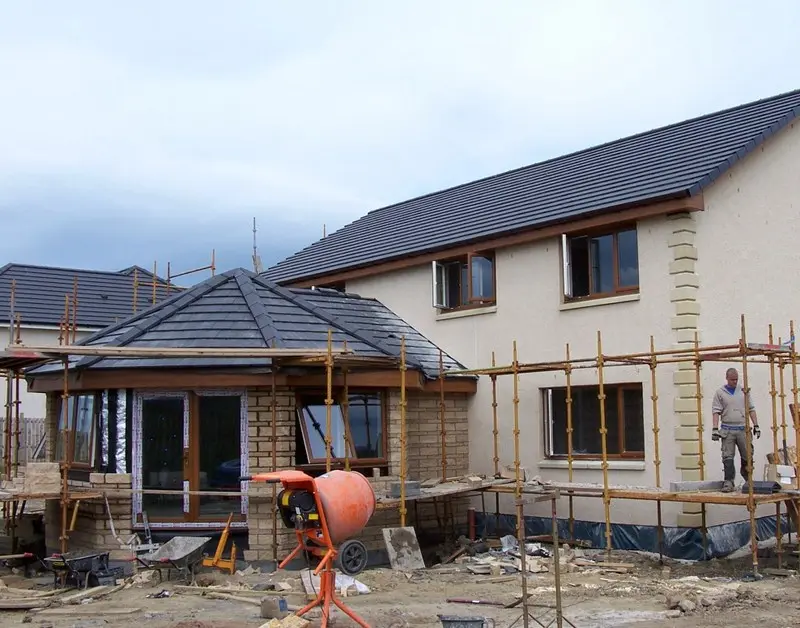 Hipped-roof sunroom going on to the side of a home