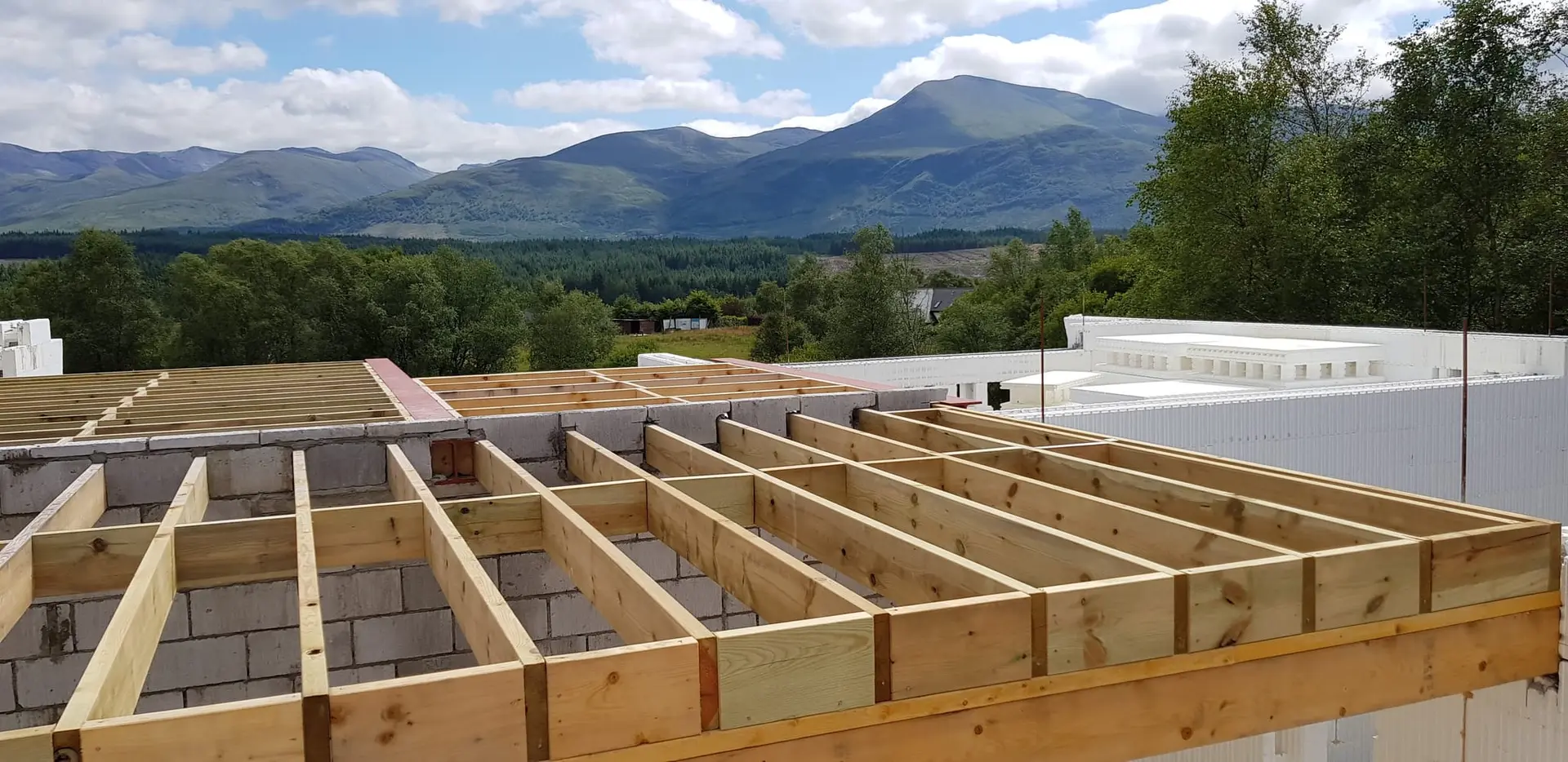 First floor joists with the mountains on the horizon