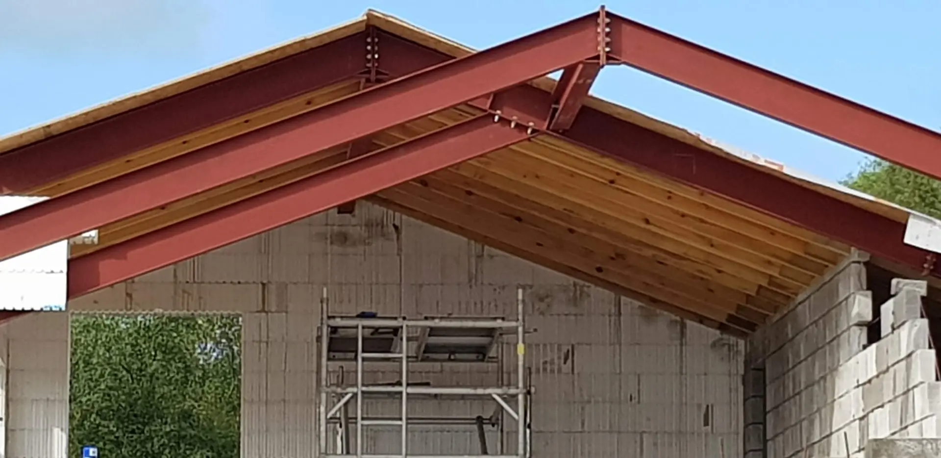 Inside the roof, with the steel frame and timber sarking