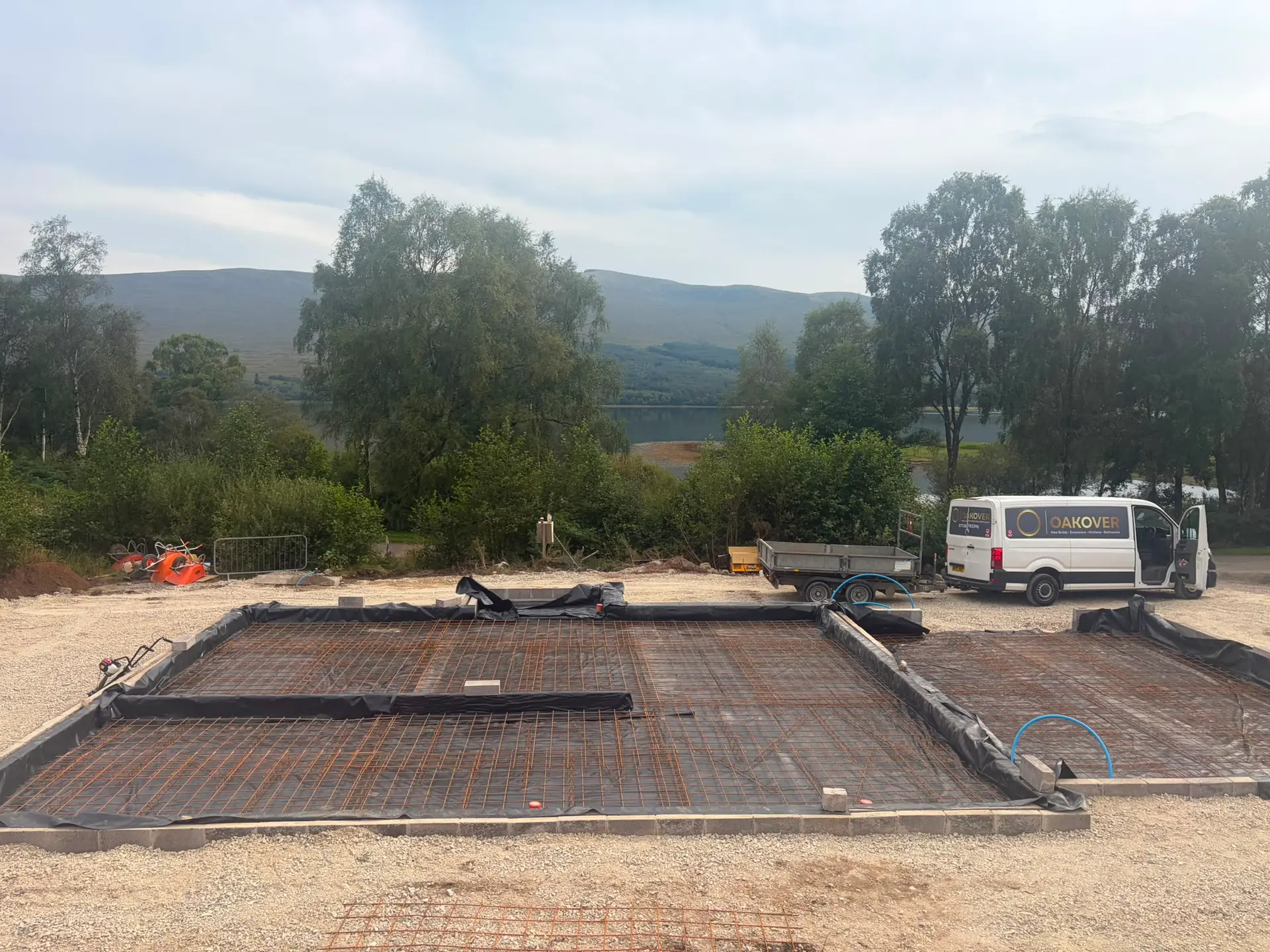 Steel mesh and damp-proof membrane laid ready for the slab, loch beyond