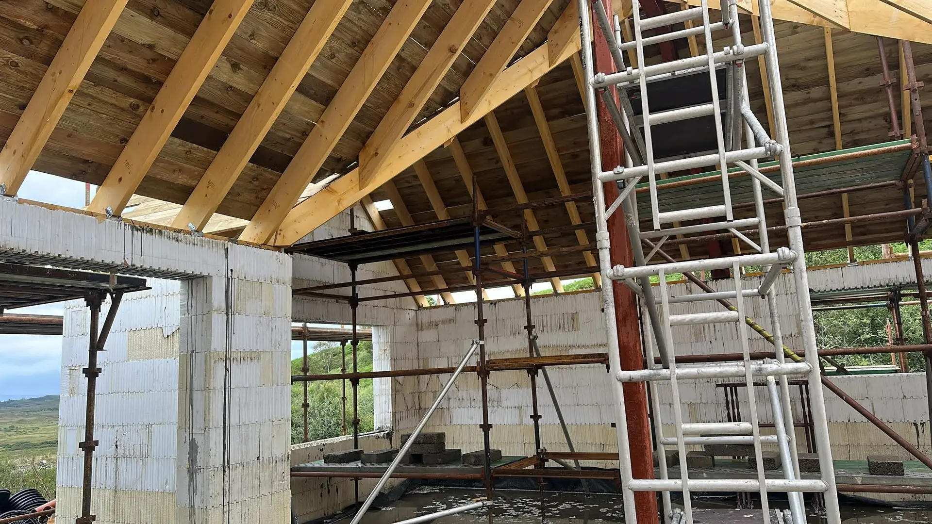 Roof rafters and sarking on the ICF walls, seen from inside