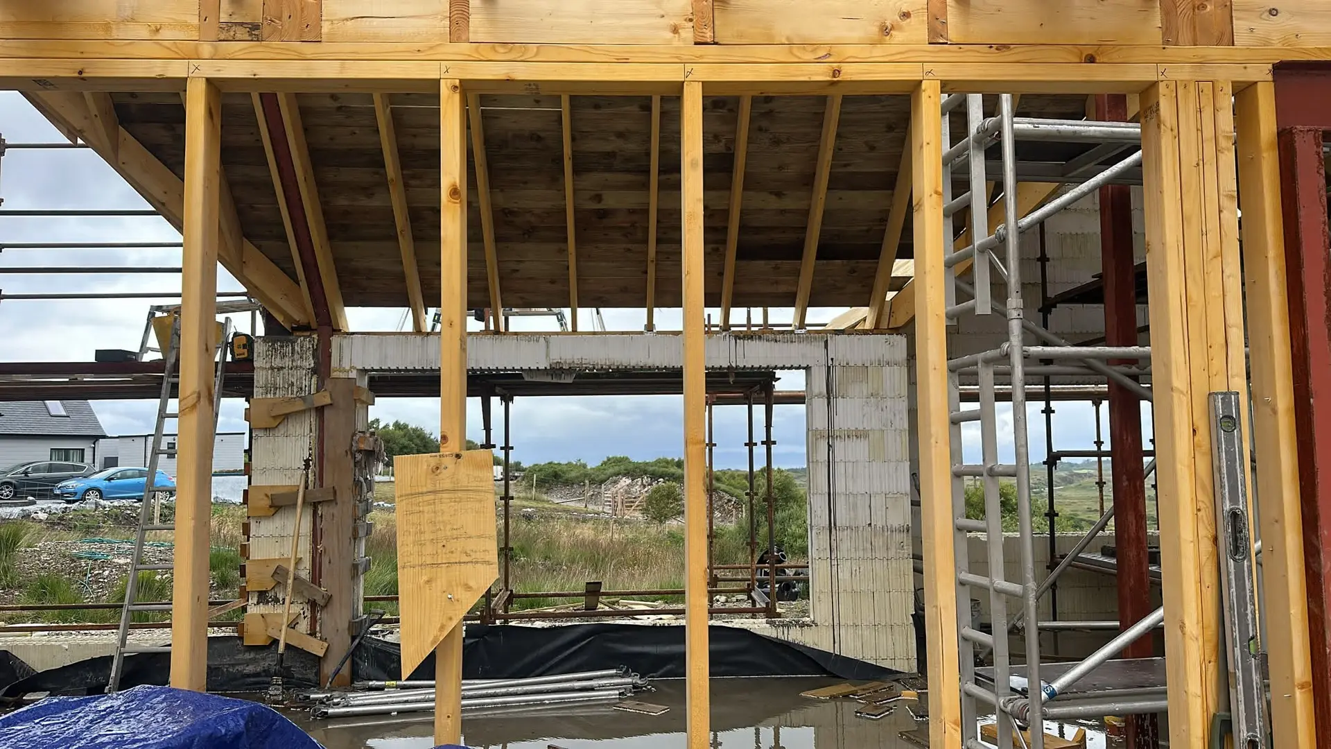 Timber stud walls framing a view through the window openings