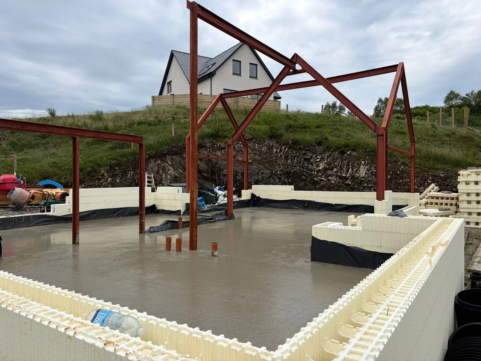 Freshly poured slab inside the ICF walls and steel frame