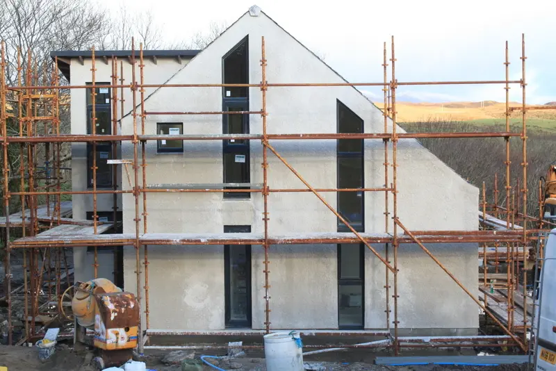 Sasaig gable end rendered with tall feature windows, still under scaffold