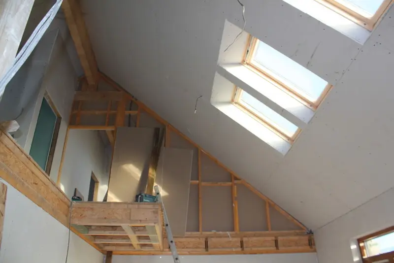 Sasaig vaulted ceiling being plasterboarded around the rooflights